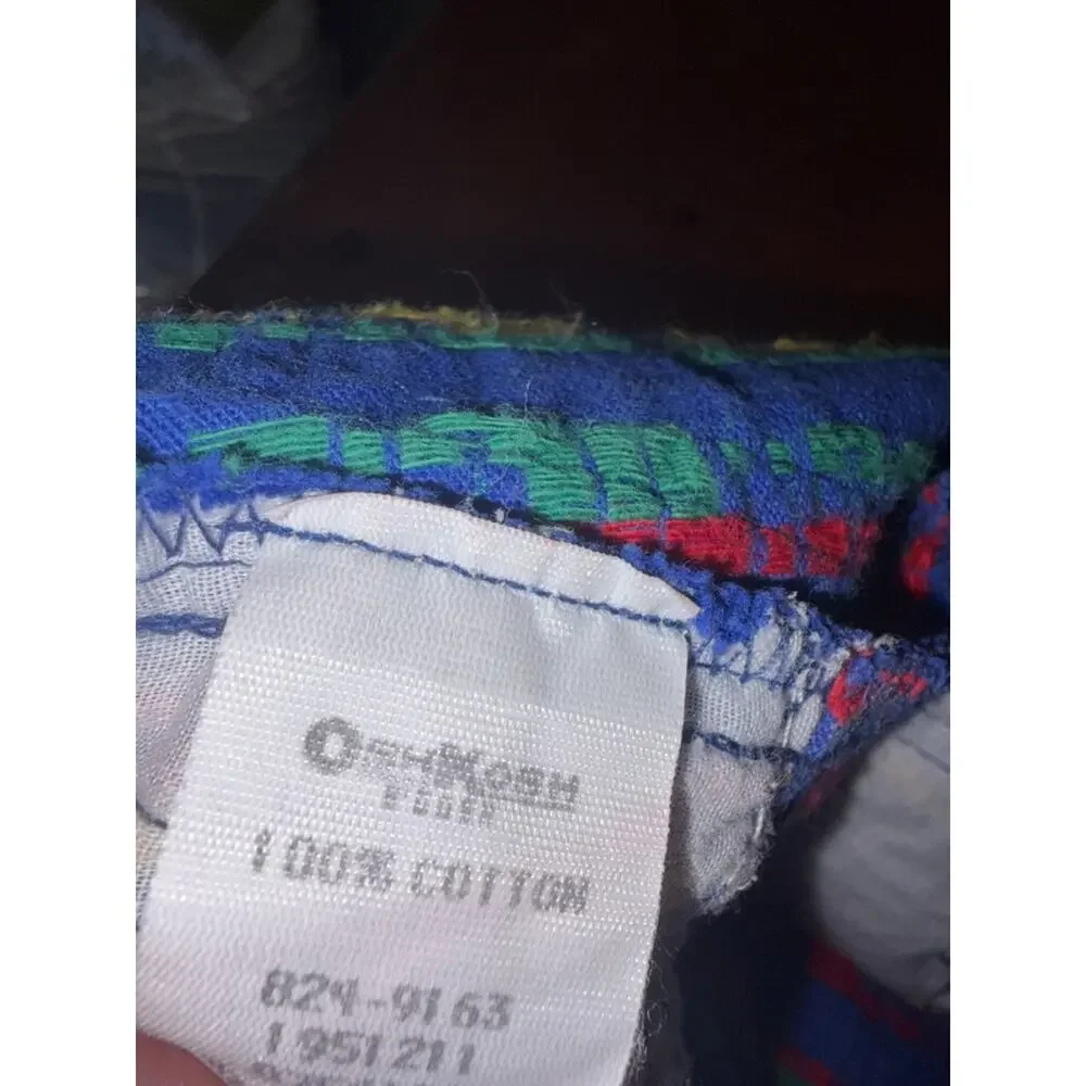 OshKosh B'gosh Bright Blue Overalls with Red, Yellow and Green Train Print